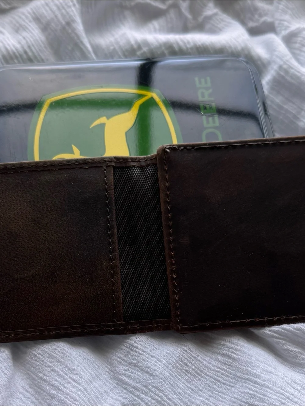 John Deere genuine leather money clip wallet in its original collectible tin.